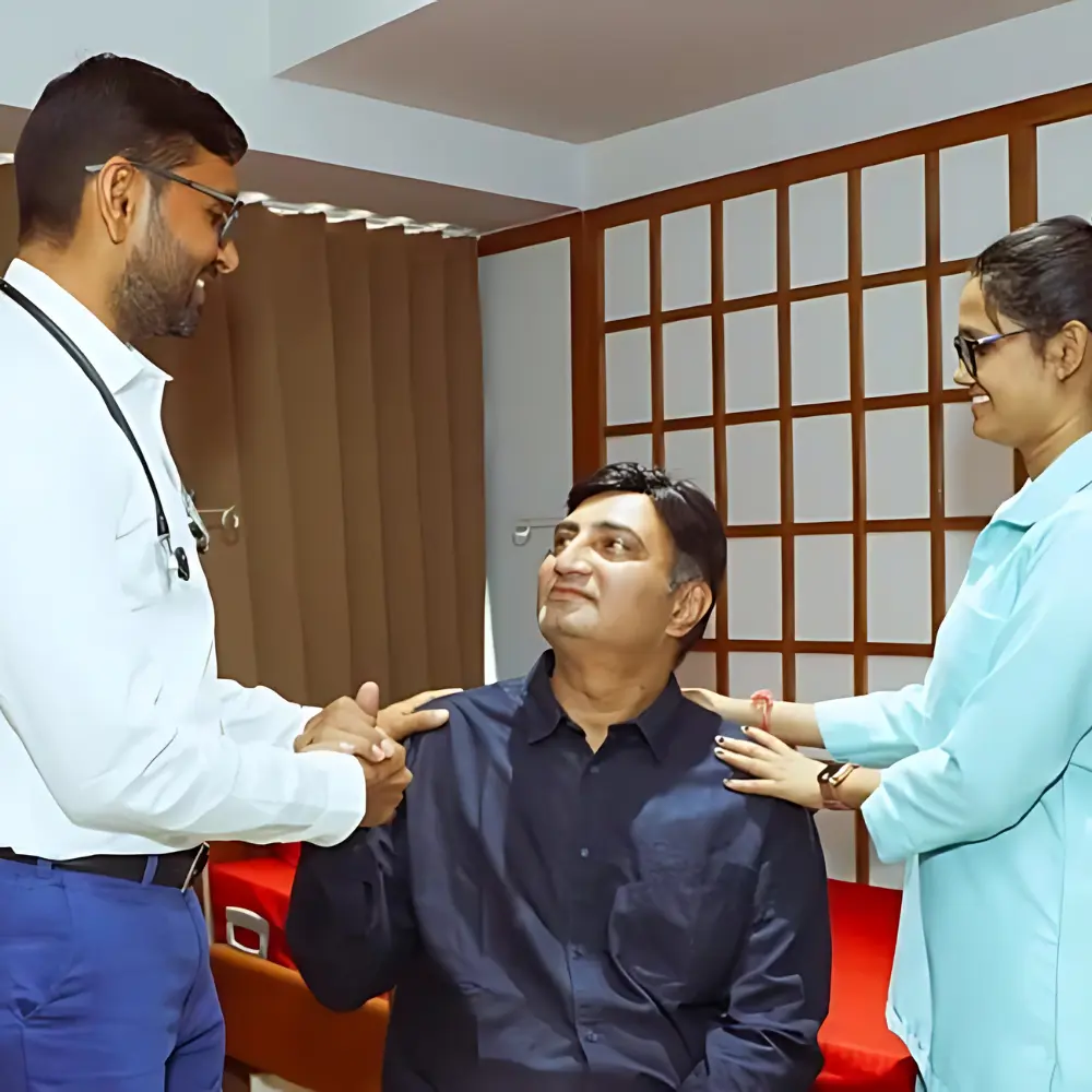 Dr. Alpesh Patel in consultation with a patient at Tirtham Surgical Hospital